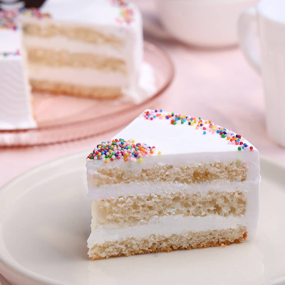 Vanilla Cream Cake Side View of Sprinkled Adventure - A Vanilla Cake