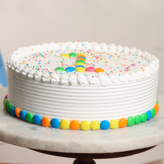 Side view of Sprinkle Gems First Birthday Cake