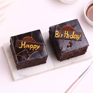 Side View of Set of Two Happy Birthday Pastry