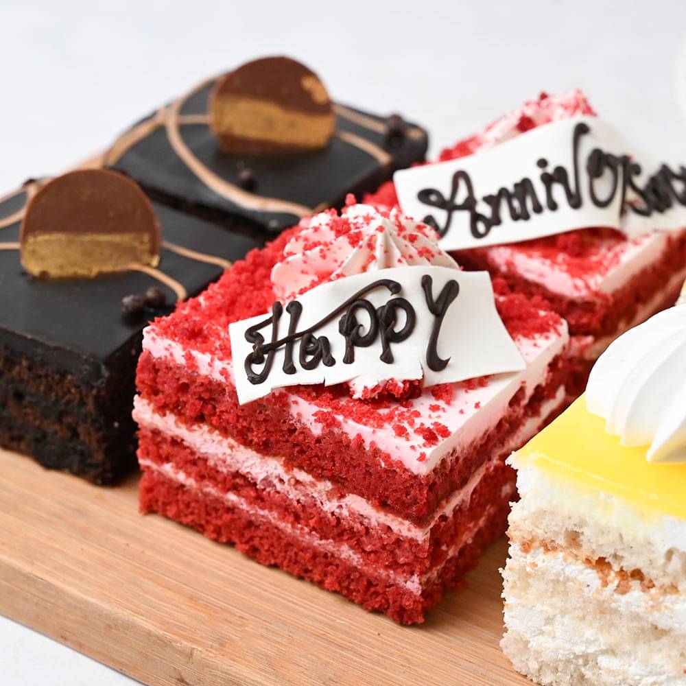 Side View of Six Pineapple Chocolate and Red Velvet Anniversary Pastries