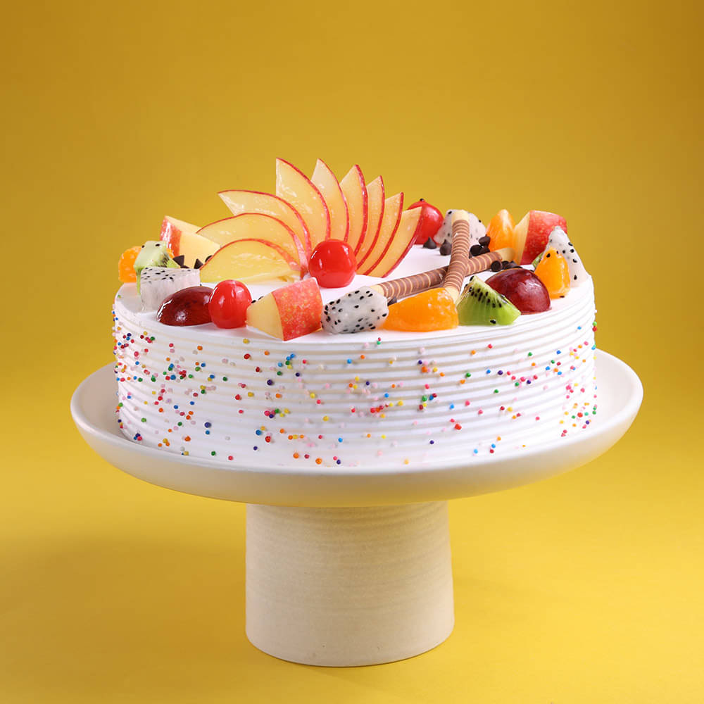 Side View of Fruits & Sprinkles Vanilla Cake