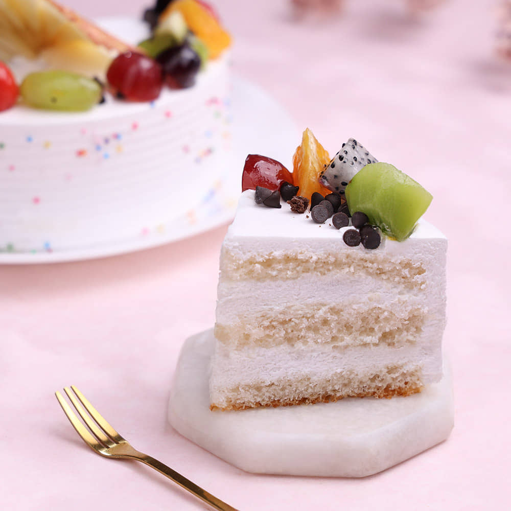 Sliced View of Fruits & Sprinkles Vanilla Cake