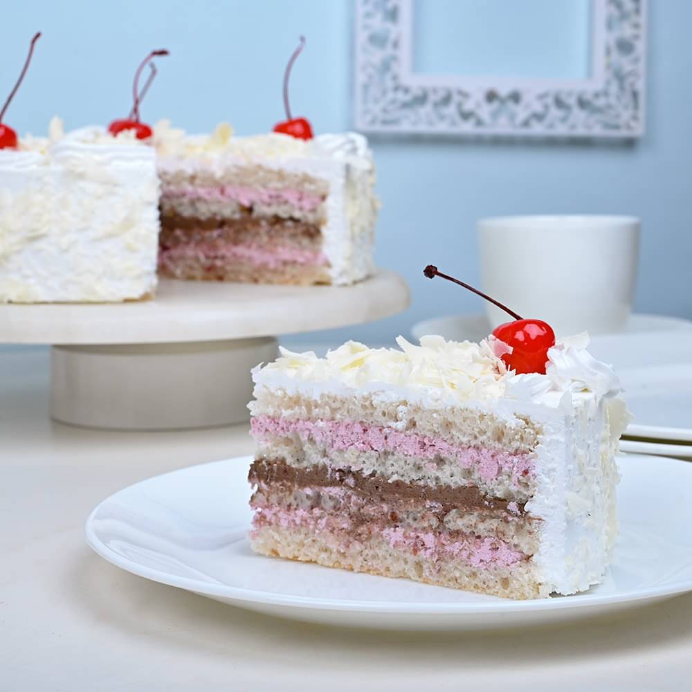 Sliced View of White Paradesia - A White Forest Cake