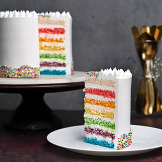 Sliced View of Rainbow Sprinkles Cake