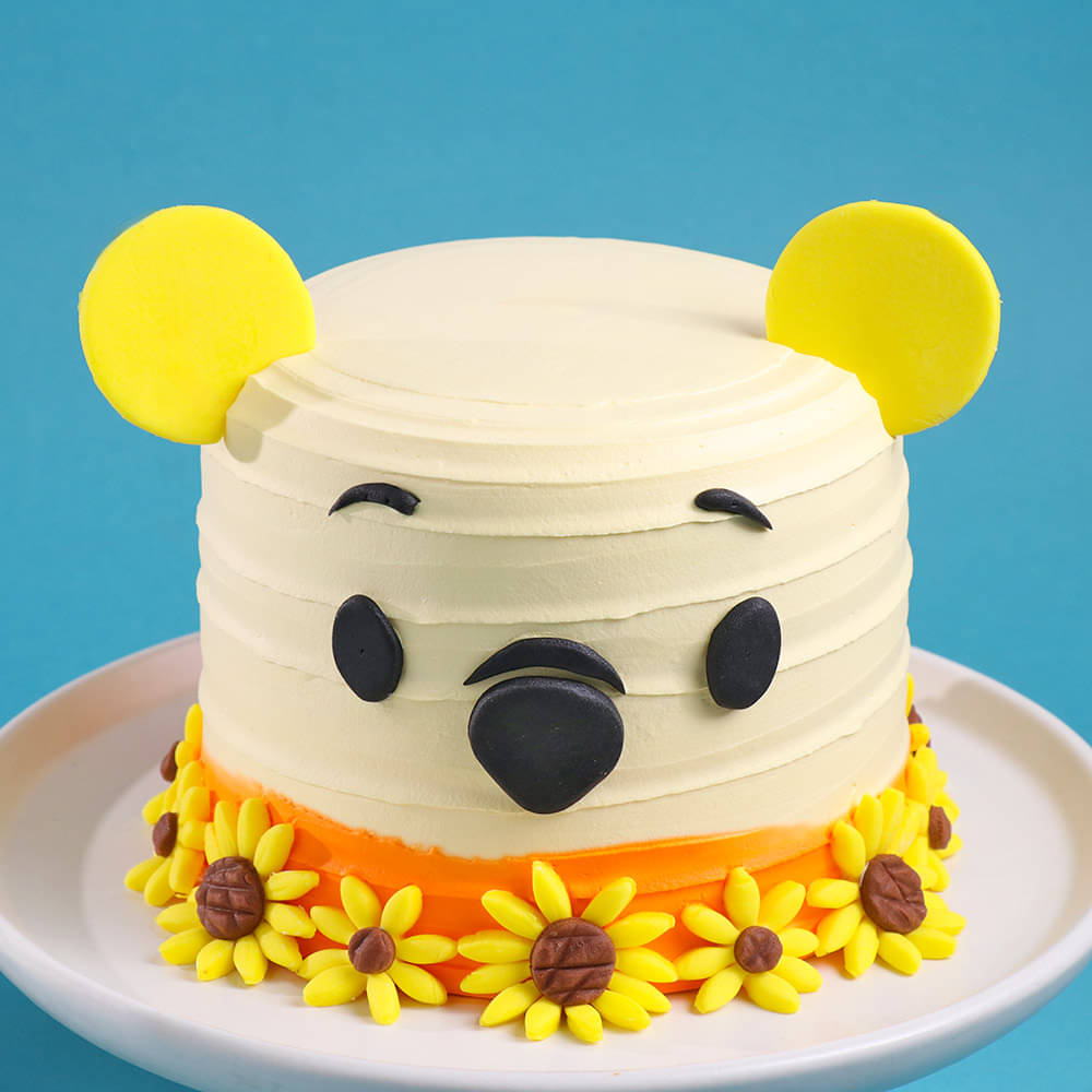 Zoomed-In View of Sunny Blooms Pooh Cake