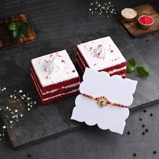 Two Red Velvet Pastries With Peacock Rakhi