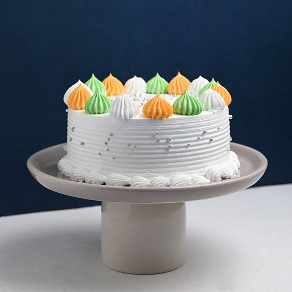Side View of Top Cream Dollops Vanilla Cake