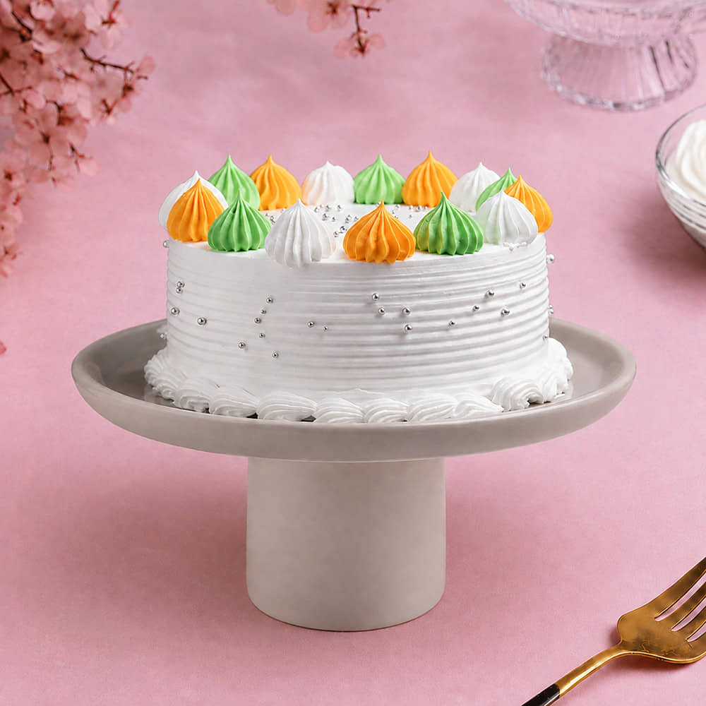 Side View of Top Cream Dollops Vanilla Cake