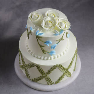 Side View of White Roses Floral Cake